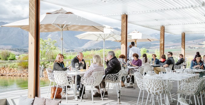 View of Cavalli Restaurant and surrounds with people dining on deck