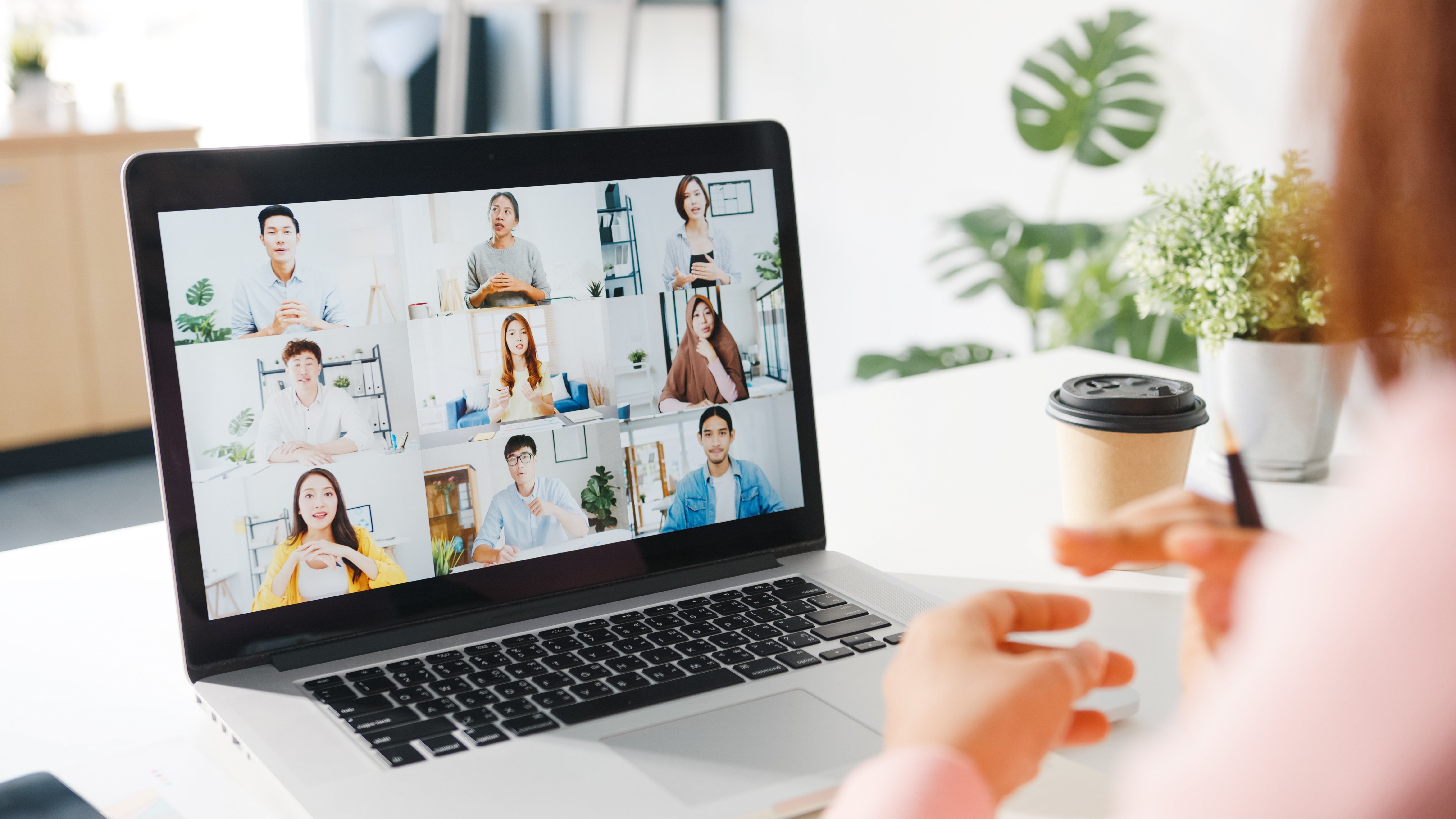 Laptop with people on a webinar