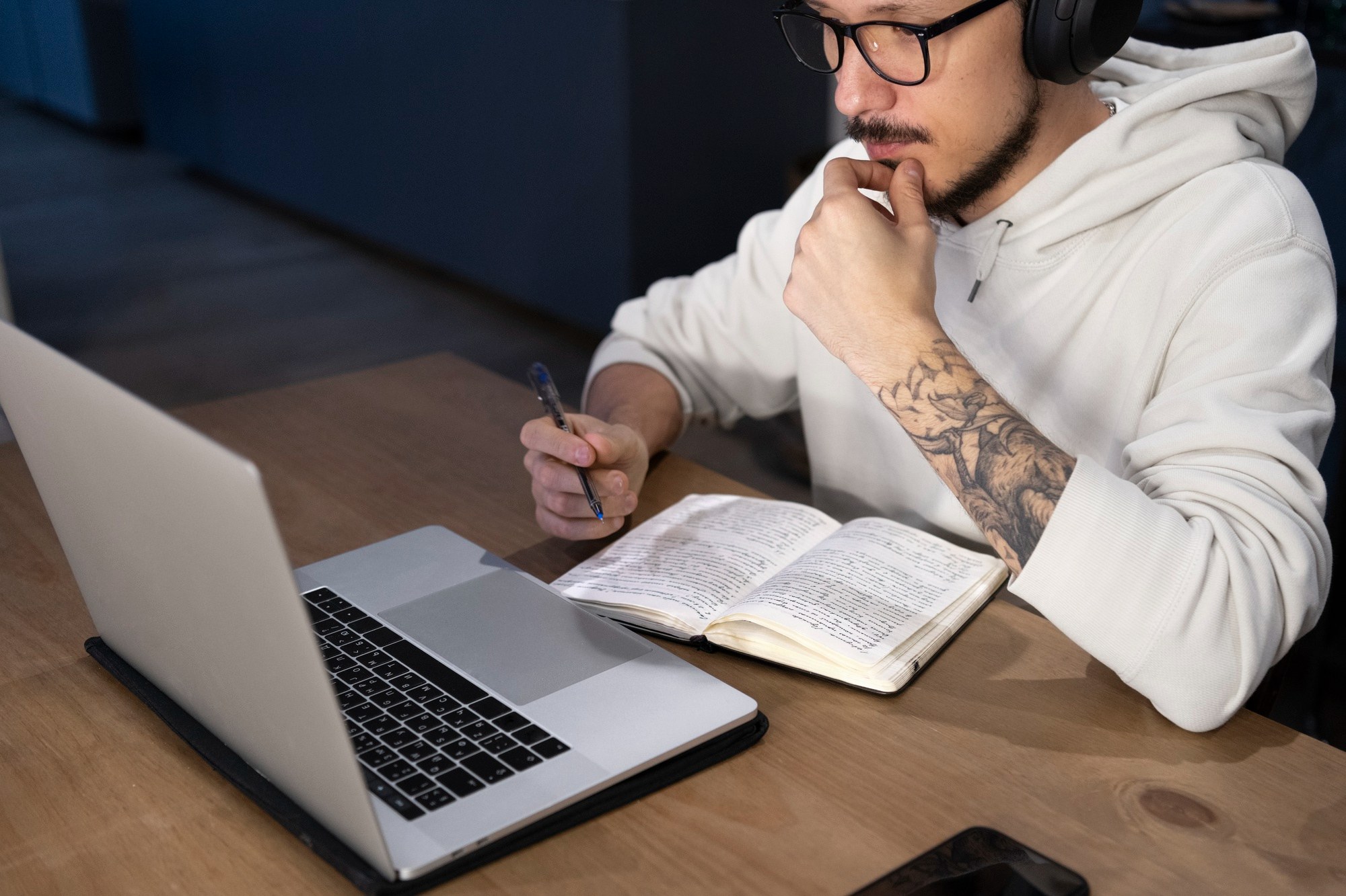 Man working from home at desk with laptop