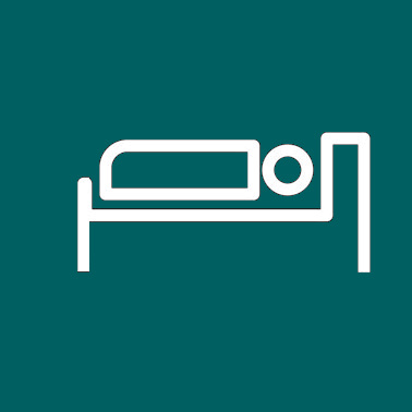 Person sleeping in bed icon