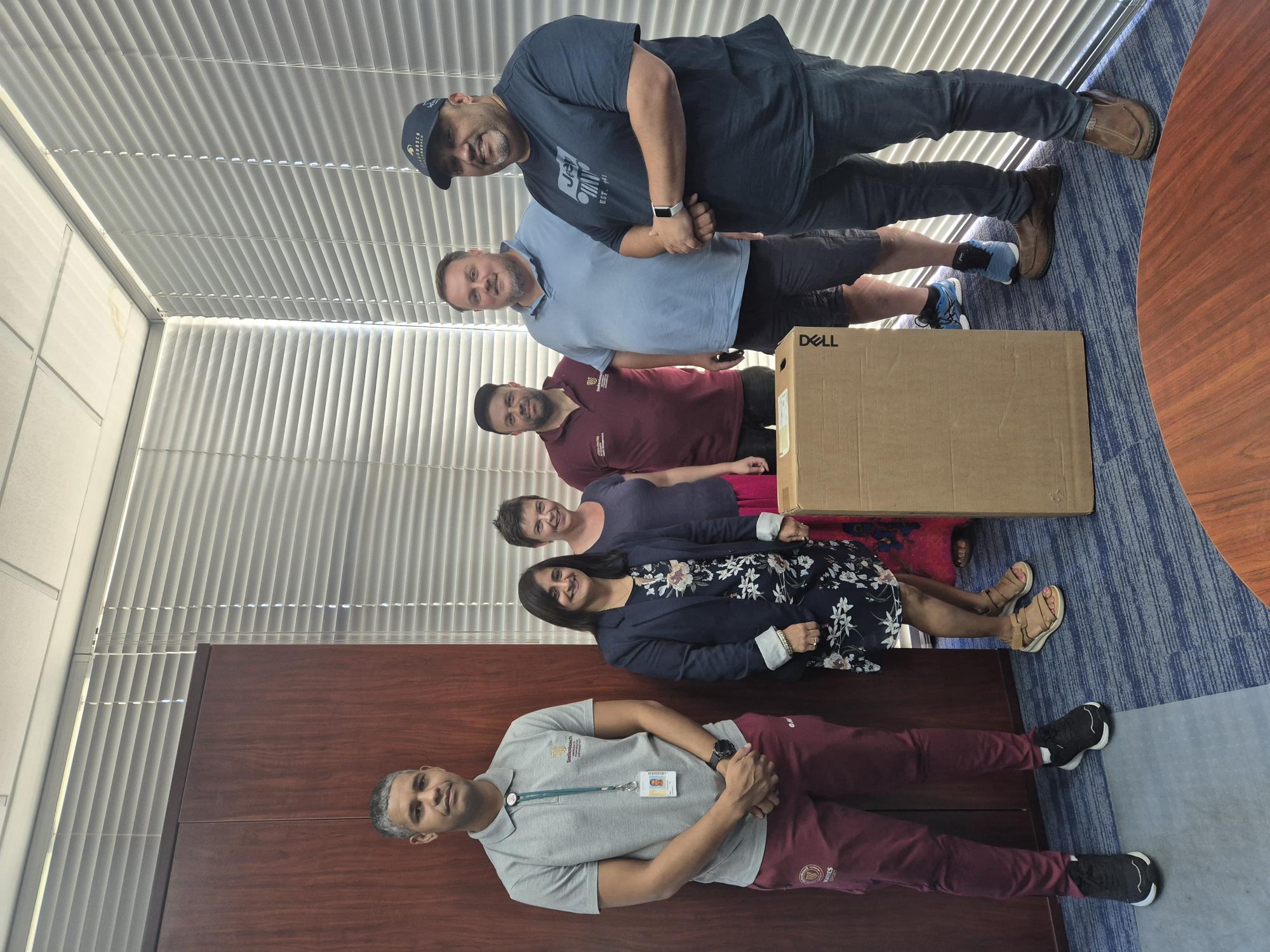Dr Mary Nel, Senior Lecturer in the Department of Public Law and Director of the Ubuntu Learning Community (3rd from left) received the donation of computers from Mrs Heena Jivan (next to her), Head of IT and Operations of EMS, and IT team members (f.l.t.r.) Denver Anthony, Remé du Plessis, Chris Bosman and Thurlo Muller.