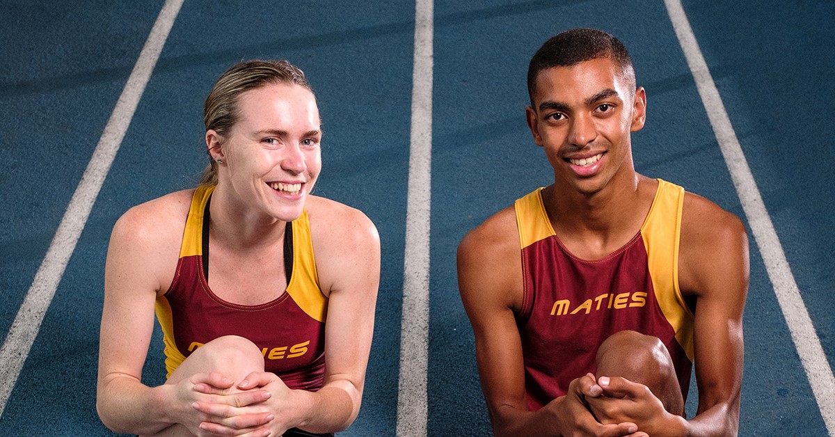 Two athletes stretching