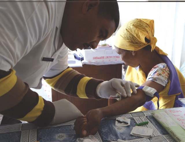 Medical professional assisting a patient