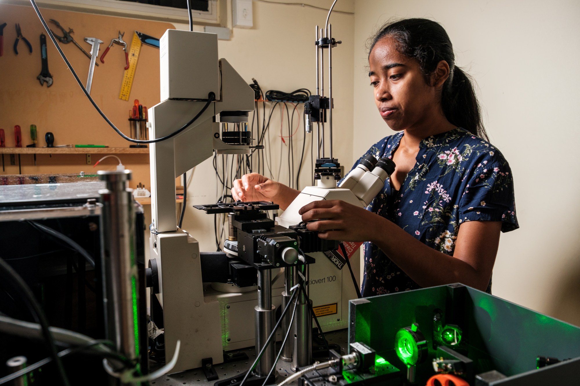 Physics student working in a photonics laboratory in the Department of Physics
