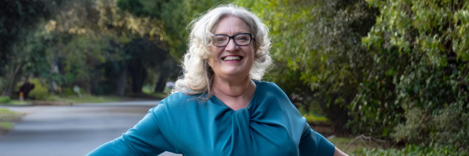 Prof Nina Schumann in a blue dress in Stellenbosch