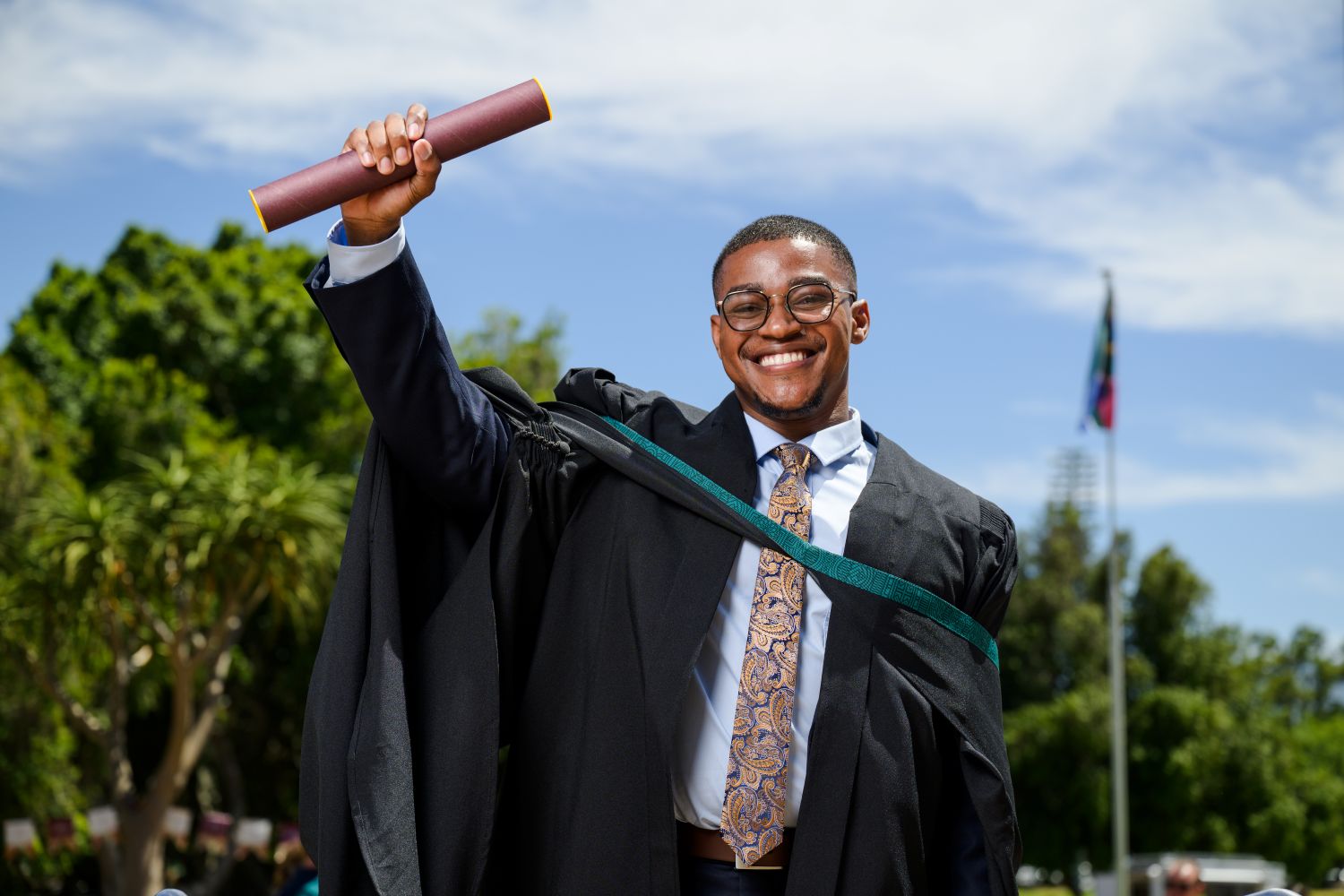 Reuben Masia celebrates his graduation