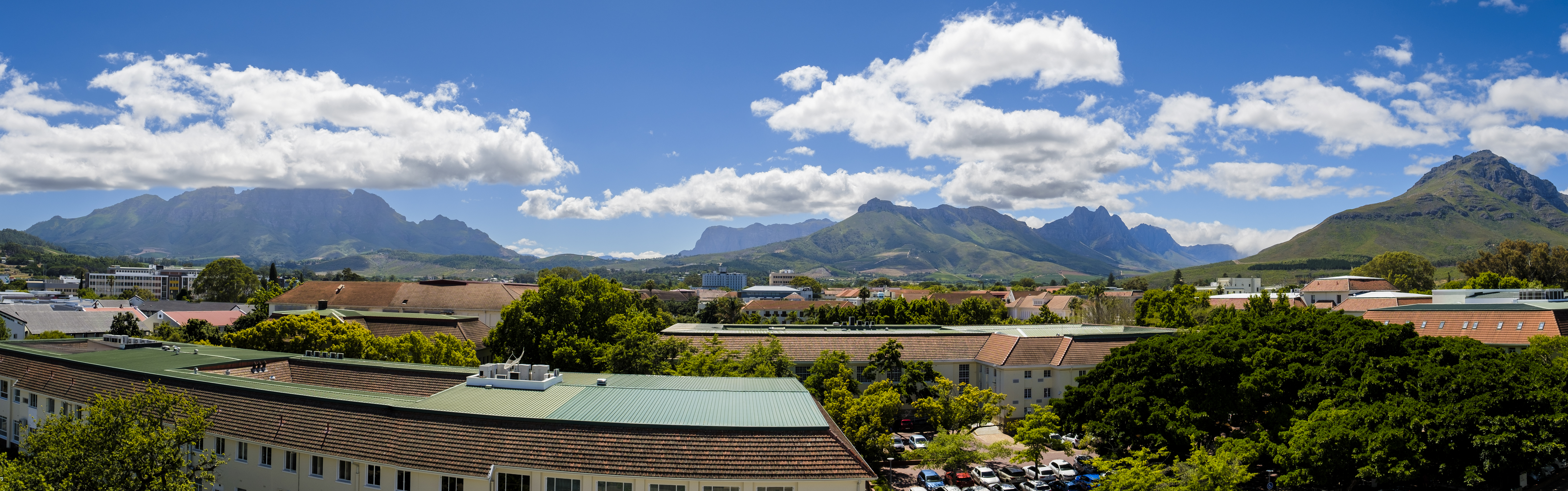A view of part of the Stellenbosch campus from the Department of Educational Psychology with mountains in the background.
