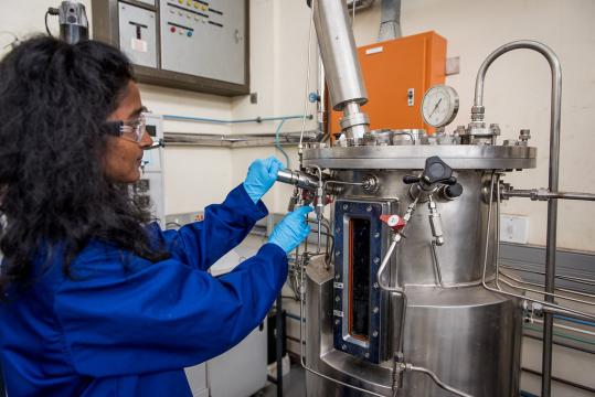 Researcher operating equipment