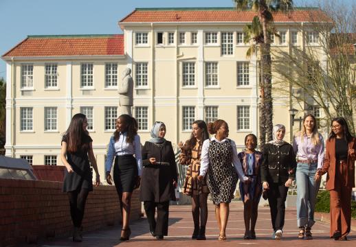 Celestine Kemunto Nyamari, a CERI Africa Stars Research Fellow from Kenya, walking with fellow CERI scholars on SU campus