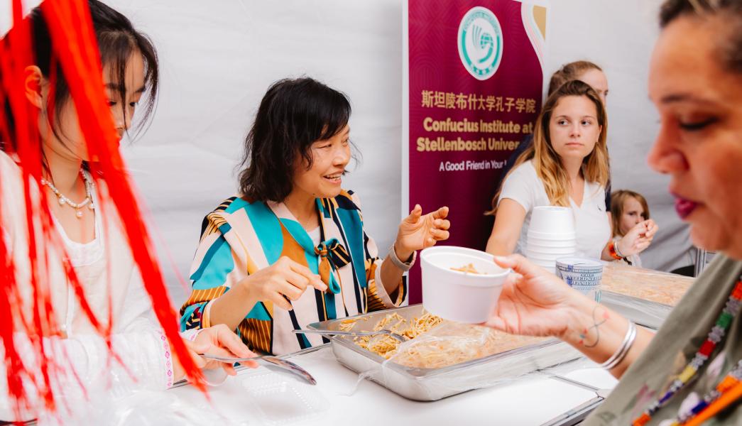 CI serving food at the international food evening 