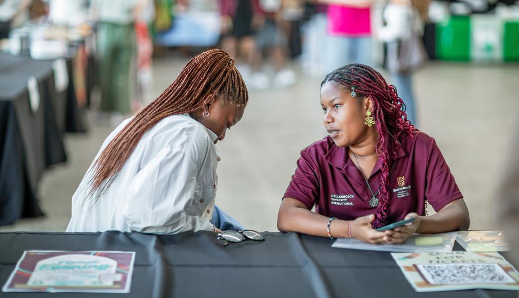 Matie buddies at the International food evening selling tickets 