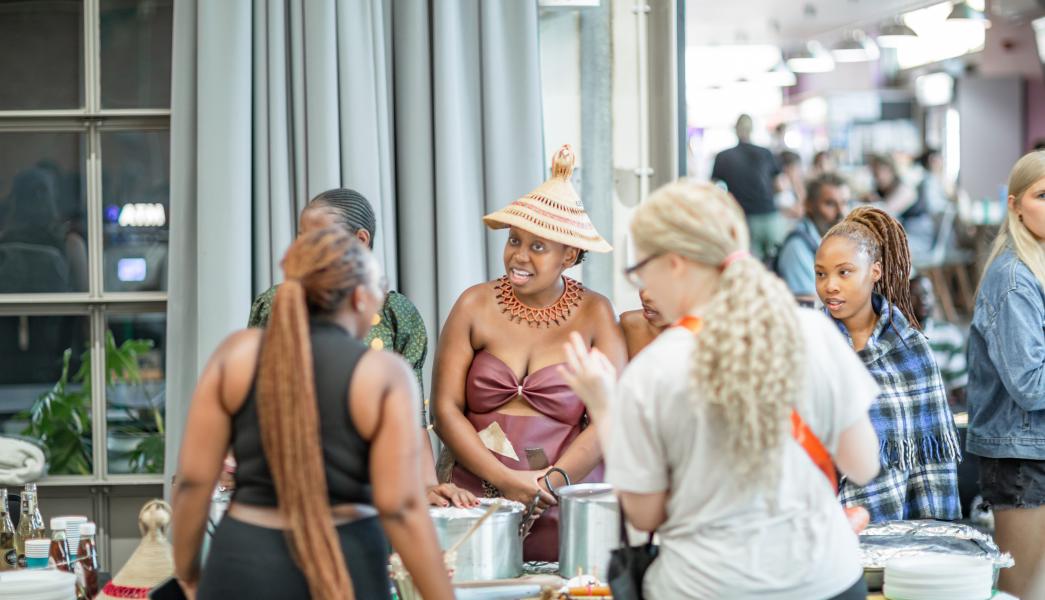 Lesotho Students serving traditional food at the iFE