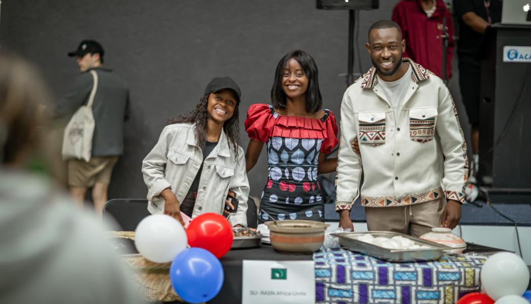 Students a the french stall at the international food evening