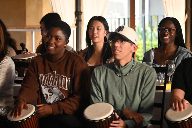 Participants from the SU International Summer School participating in  African drumming lessons