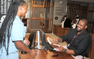Student renew book at Client Service in the Stellenbosch University Library