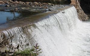 Sampling downriver from a Waste Water Treatment Plant in a large South African city.