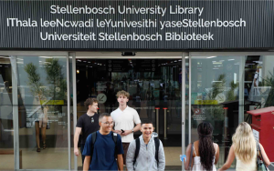 Student walking out of Stellenbosch University Library