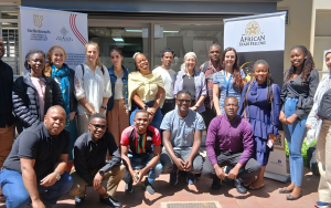 Group photo of workshop participants and facilitators outside the NITheCS office at Stellenbosch University