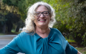 Prof Nina Schumann in a blue dress in Stellenbosch