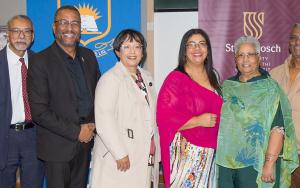 From left are Stanley Amos, Mohamed Shaikh, Jeremy Fasser, Prof Benita Nel, Renée Hector-Kannemeyer, Annette and Ian Johnson, and Prof Mbulungeni Madiba at the 2026 Walter Parry Memorial Lecture honouring the life and educational legacy of Eva Johnson. 