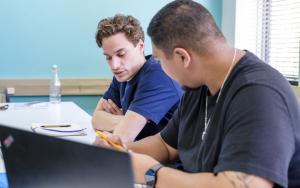 Photo of two students studying together