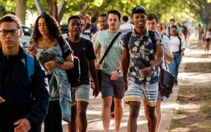 Photo of a diverse group of students walking down Victoria Street