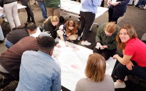 Photo of students working together during the MatiesLead training offered by the Frederik Van Zyl Slabbert Institute