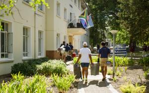 Students carrying in items to their new residence during move-in day in Welcoming 2026