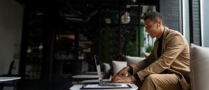 Man Enjoying working on laptop