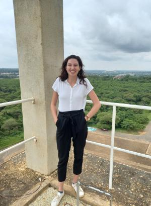 Shani Lange smiling in front of a forest background