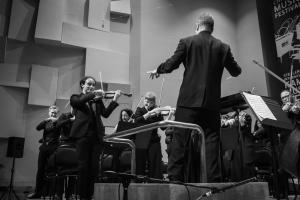 conductor with orchestra