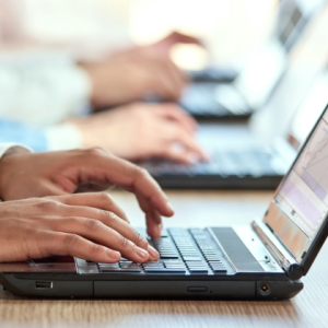 man hands typing on keyboard
