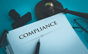 white paper with the word compliance