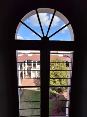 A glance at the Faculty of Law's quad through a window