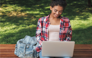 student-outside-with-laptop