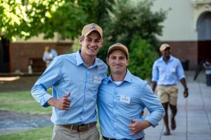 Two male student leaders give the thumbs-up sign