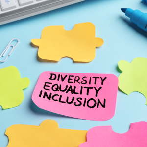 Photo of different colour Post-it note stickers with one sticker with the words Diversity, Equality, Inclusion on it. 