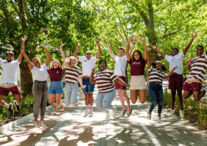 a group of maties students jumping on victoria street 