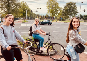 3 students on bicycles 