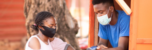 Two people wearing a mask 