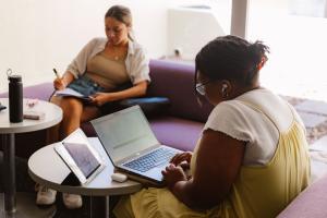 two students in the library study area