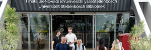 Student walking out of Stellenbosch University Library