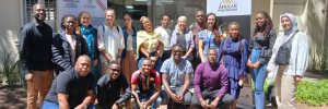Group photo of workshop participants and facilitators outside the NITheCS office at Stellenbosch University