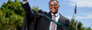 Reuben Masia celebrates his graduation