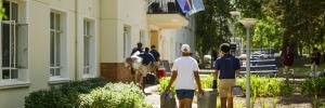 Students carrying in items to their new residence during move-in day in Welcoming 2026