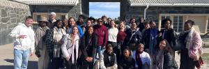 A photo of the 34 head mentors in front of the Robben Island prison gates during their visit to Robben Island as part of the SU Mentor programme’s experiential learning curriculum