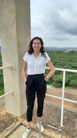Shani Lange smiling in front of a forest background